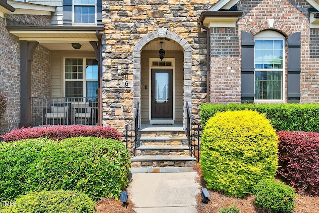 1806 Pattersons Mill Rd, Durham, NC 27703 - view of exterior entry featuring brick siding and stone siding