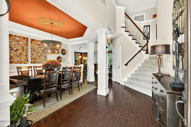 1806 Pattersons Mill Rd, Durham, NC 27703 - entrance foyer featuring decorative columns, dark wood-style flooring, stairway, a tray ceiling, and ornamental molding