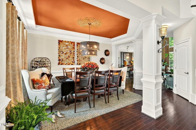 1806 Pattersons Mill Rd, Durham, NC 27703 - dining space featuring ornate columns, a raised ceiling, and dark wood finished floors