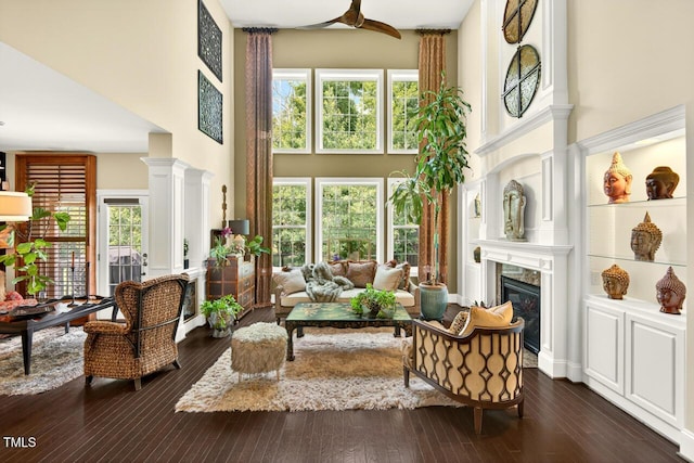 1806 Pattersons Mill Rd, Durham, NC 27703 - living room featuring a high ceiling, a fireplace, dark wood-type flooring, healthy amount of natural light, and ceiling fan