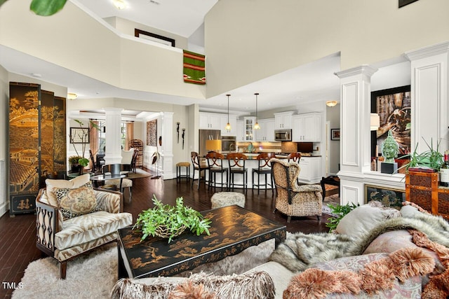 1806 Pattersons Mill Rd, Durham, NC 27703 - living area with ornate columns, dark wood finished floors, and a high ceiling