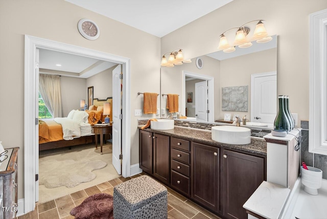 1806 Pattersons Mill Rd, Durham, NC 27703 - ensuite bathroom featuring double vanity and wood finish floors