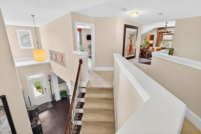 1806 Pattersons Mill Rd, Durham, NC 27703 - stairs with a chandelier and wood finished floors