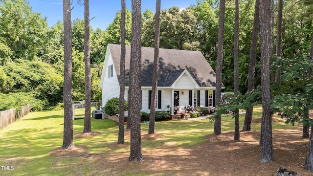918 Circle Dr, Angier, NC 27501 - cape cod house with a shingled roof and view of scattered trees