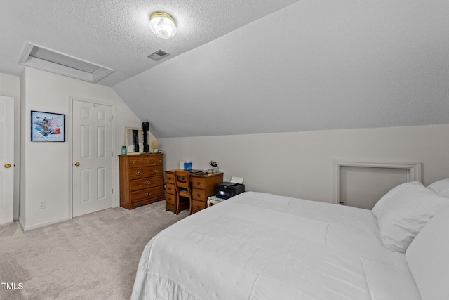 918 Circle Dr, Angier, NC 27501 - bedroom featuring attic access, carpet, vaulted ceiling, and a textured ceiling
