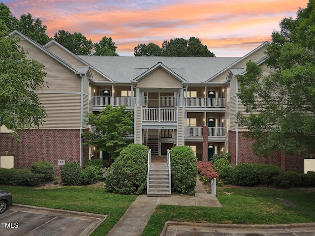 922 Glenolden Ct, Cary, NC 27513 - property at dusk featuring stairway and uncovered parking