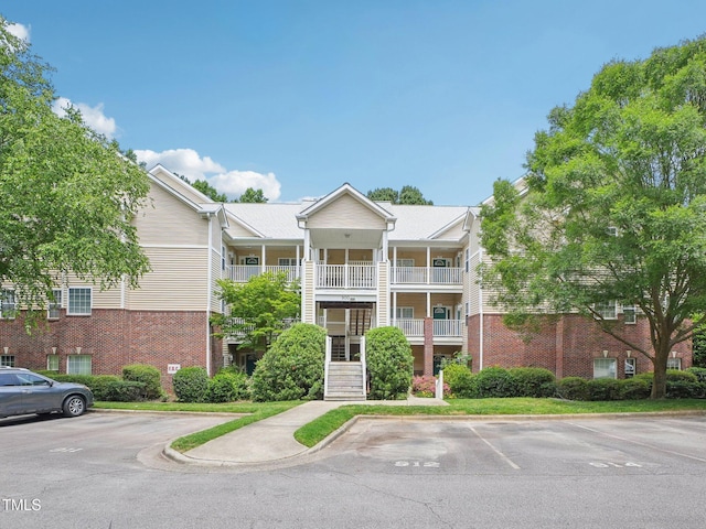922 Glenolden Ct, Cary, NC 27513 - view of building exterior featuring uncovered parking and stairs