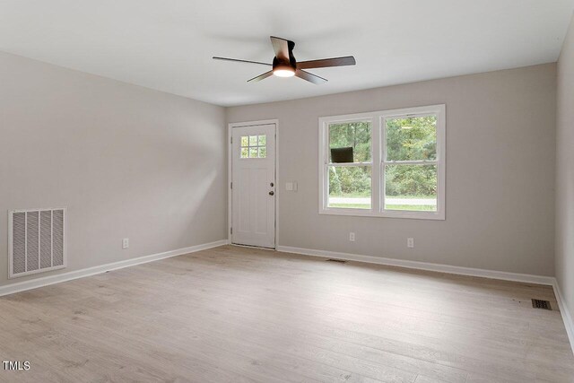 1203 Freeman Dr, Sanford, NC 27330 - empty room with a ceiling fan and light wood-type flooring