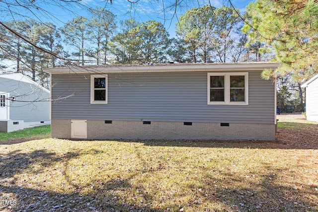 1203 Freeman Dr, Sanford, NC 27330 - view of side of home with crawl space and a lawn