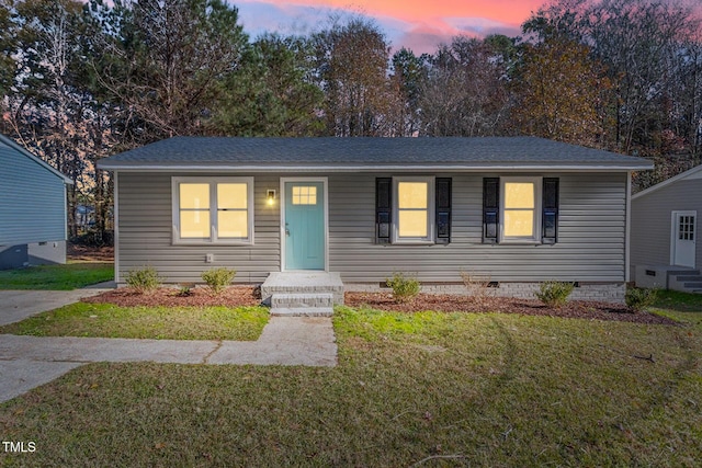 1203 Freeman Dr, Sanford, NC 27330 - view of front of property with crawl space, a front lawn, and a shingled roof