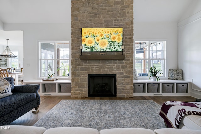 447 Marcellus Way, Clayton, NC 27527 - living room with wood finished floors, a fireplace, and vaulted ceiling