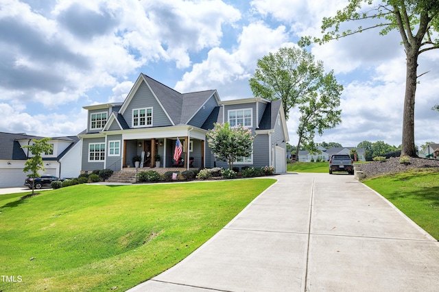 447 Marcellus Way, Clayton, NC 27527 - view of front of house featuring a porch, a front yard, and concrete driveway