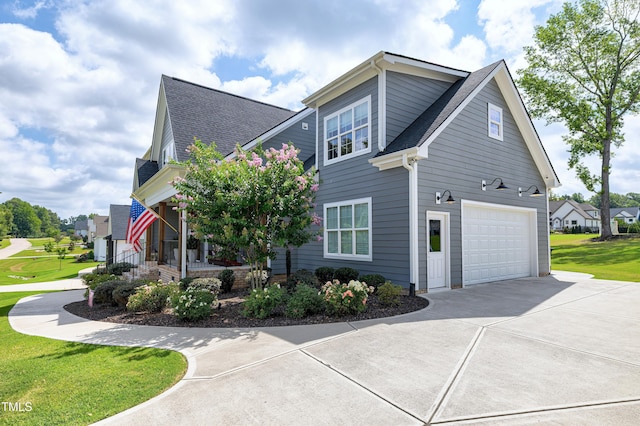 447 Marcellus Way, Clayton, NC 27527 - view of home's exterior featuring driveway, a garage, a porch, roof with shingles, and a lawn