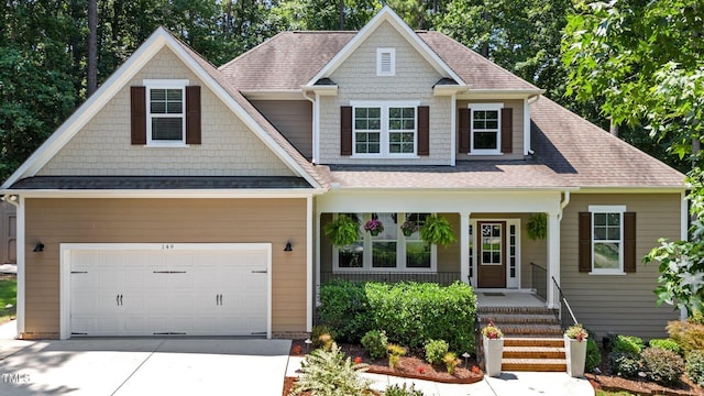 149 Hadley Ln, Clayton, NC 27527 - craftsman inspired home featuring a porch, concrete driveway, and roof with shingles