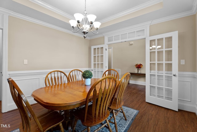 149 Hadley Ln, Clayton, NC 27527 - dining area with a chandelier, wood finished floors, ornamental molding, wainscoting, and a raised ceiling