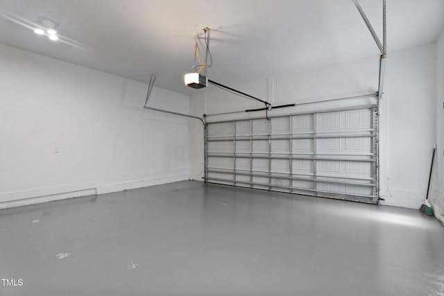 149 Hadley Ln, Clayton, NC 27527 - garage with a garage door opener and baseboards