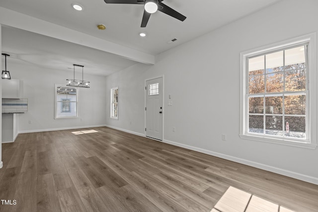 112 Edgewood Dr, Roxboro, NC 27573 - unfurnished living room with a ceiling fan, wood finished floors, recessed lighting, and a chandelier