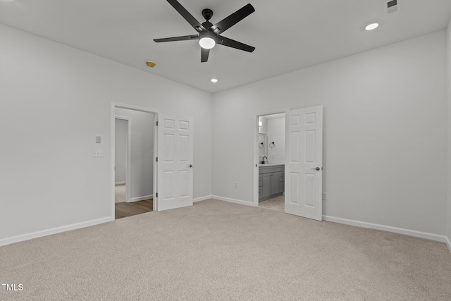 112 Edgewood Dr, Roxboro, NC 27573 - unfurnished bedroom with light carpet, recessed lighting, connected bathroom, and ceiling fan