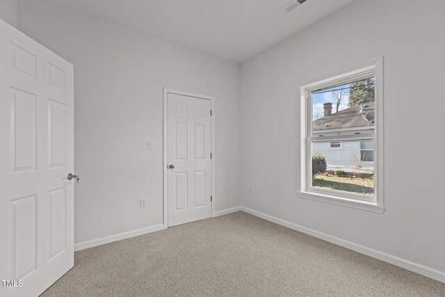 112 Edgewood Dr, Roxboro, NC 27573 - unfurnished bedroom with carpet and baseboards