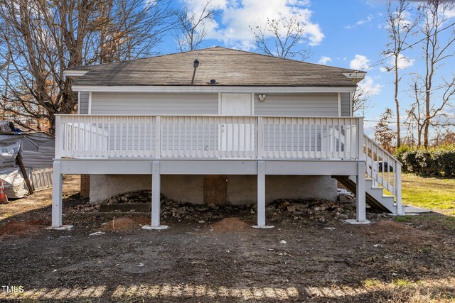 112 Edgewood Dr, Roxboro, NC 27573 - back of property featuring roof with shingles, a wooden deck, and stairs