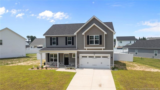 283 Leach Creek Dr, Raeford, NC 28376 - craftsman inspired home with a porch, driveway, an attached garage, and stone siding