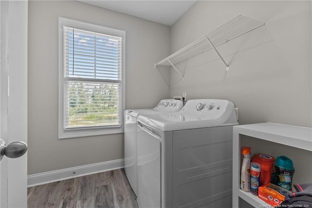 283 Leach Creek Dr, Raeford, NC 28376 - washroom with separate washer and dryer and wood finished floors