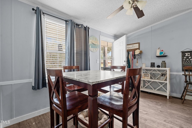 51 Brafford Estates Dr, Cameron, NC 28326 - dining room featuring ceiling fan, wood finished floors, crown molding, healthy amount of natural light, and a textured ceiling