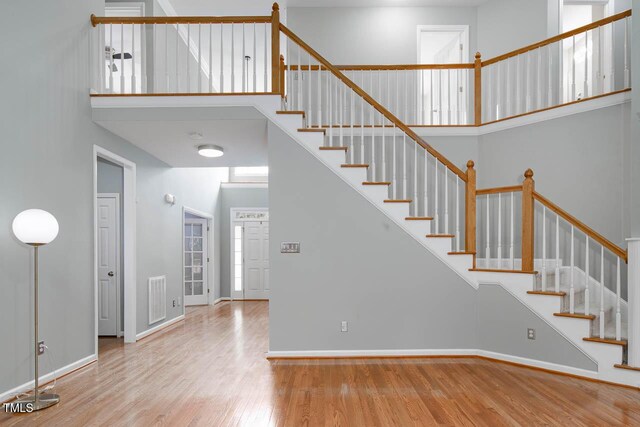 515 Wellingham Dr, Durham, NC 27713 - stairway featuring wood finished floors and a high ceiling