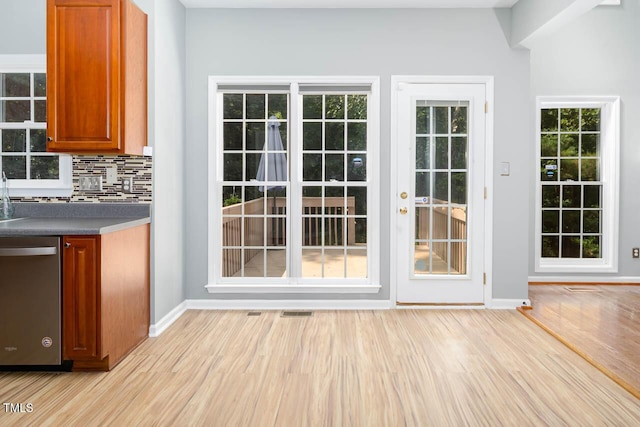 515 Wellingham Dr, Durham, NC 27713 - doorway to outside featuring light wood-style floors and baseboards