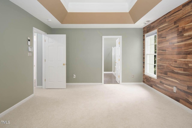 515 Wellingham Dr, Durham, NC 27713 - unfurnished bedroom with carpet floors, wood walls, and connected bathroom