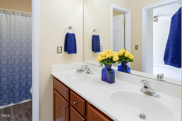 515 Wellingham Dr, Durham, NC 27713 - full bath featuring double vanity, a shower with shower curtain, and wood finished floors