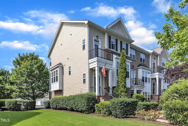 9216 Wooden Rd, Raleigh, NC 27617 - view of side of property with brick siding and a lawn