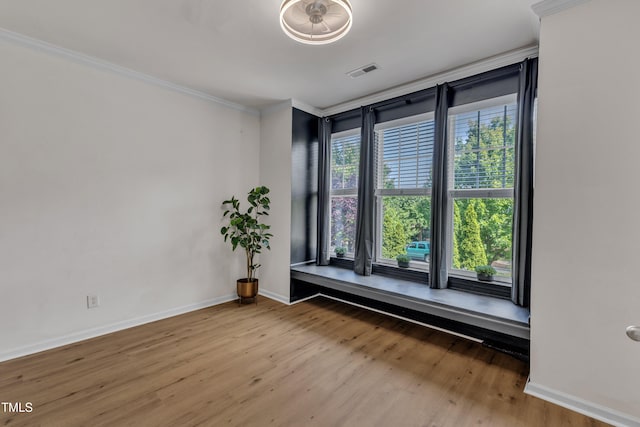 9216 Wooden Rd, Raleigh, NC 27617 - empty room featuring ornamental molding and wood finished floors