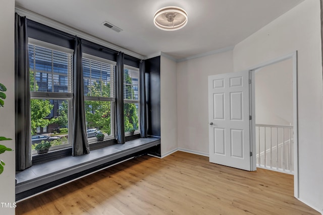 9216 Wooden Rd, Raleigh, NC 27617 - unfurnished room featuring light wood-style flooring and ornamental molding