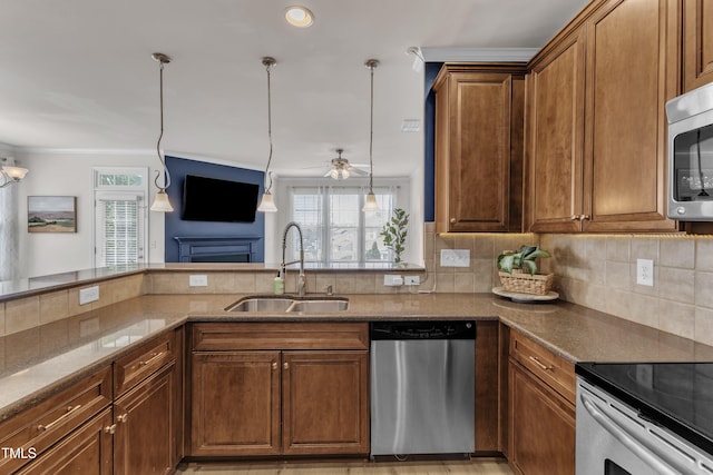9216 Wooden Rd, Raleigh, NC 27617 - kitchen with appliances with stainless steel finishes, tasteful backsplash, light stone countertops, ceiling fan, and pendant lighting