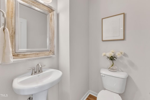9216 Wooden Rd, Raleigh, NC 27617 - bathroom with toilet and a sink