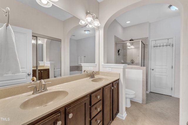 9216 Wooden Rd, Raleigh, NC 27617 - full bathroom with double vanity, a shower stall, and tile patterned flooring