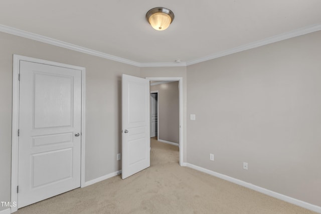 9216 Wooden Rd, Raleigh, NC 27617 - unfurnished bedroom featuring light carpet and crown molding