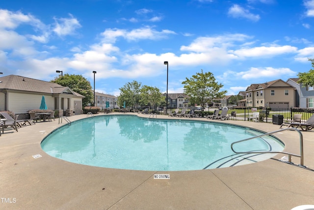 9216 Wooden Rd, Raleigh, NC 27617 - community pool featuring a residential view and a patio