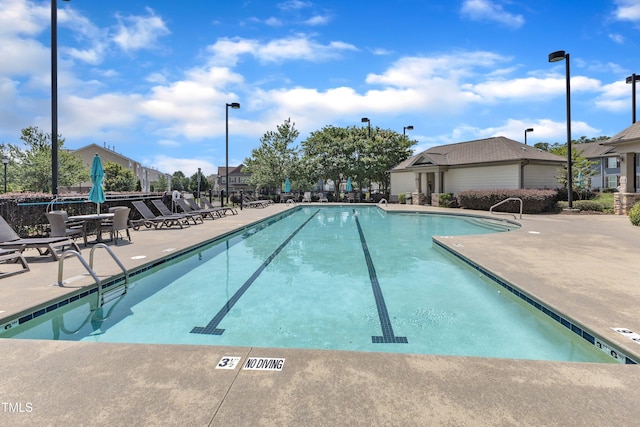 9216 Wooden Rd, Raleigh, NC 27617 - community pool featuring a patio