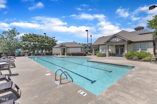 9216 Wooden Rd, Raleigh, NC 27617 - community pool featuring a patio and french doors