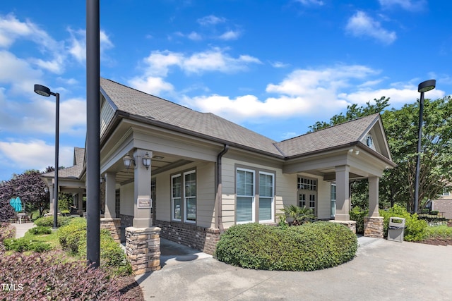 9216 Wooden Rd, Raleigh, NC 27617 - view of front facade with a porch and roof with shingles