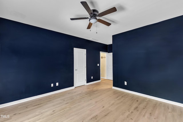 9216 Wooden Rd, Raleigh, NC 27617 - unfurnished bedroom featuring wood finished floors and a ceiling fan