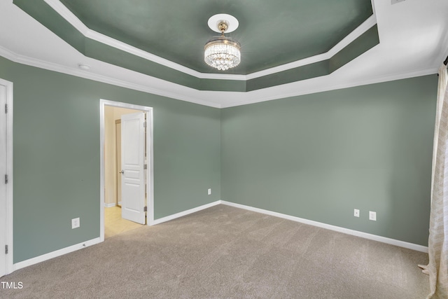 9216 Wooden Rd, Raleigh, NC 27617 - unfurnished room featuring a raised ceiling, carpet, a chandelier, and ornamental molding