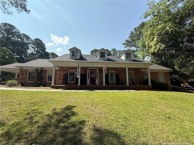 1911 Raeford Rd, Fayetteville, NC 28305 - view of front of property with a front yard, covered porch, brick siding, and a carport