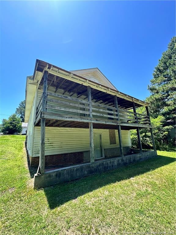410 W K St, Erwin, NC 28339 - view of property exterior with a yard and a deck
