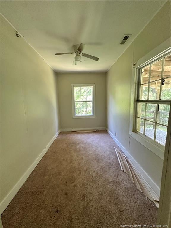410 W K St, Erwin, NC 28339 - carpeted spare room featuring a ceiling fan and baseboards