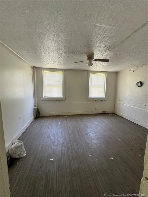 410 W K St, Erwin, NC 28339 - empty room featuring ceiling fan, a textured ceiling, and hardwood / wood-style floors