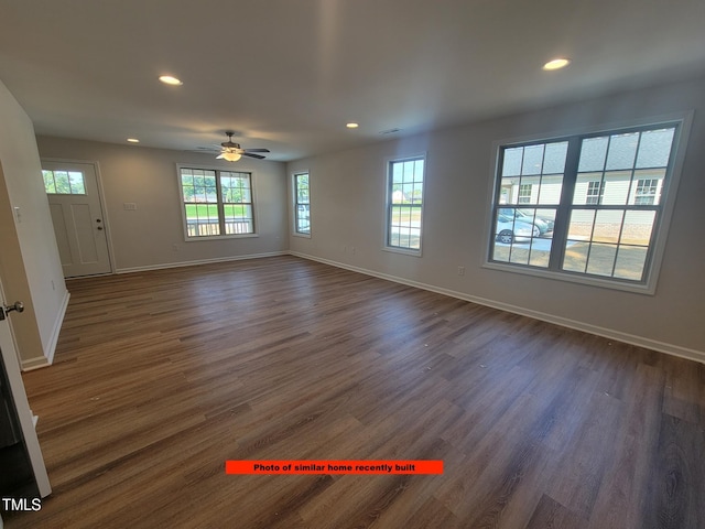 307 E Holmes St, Benson, NC 27504 - unfurnished room with healthy amount of natural light, recessed lighting, dark wood-style flooring, and ceiling fan
