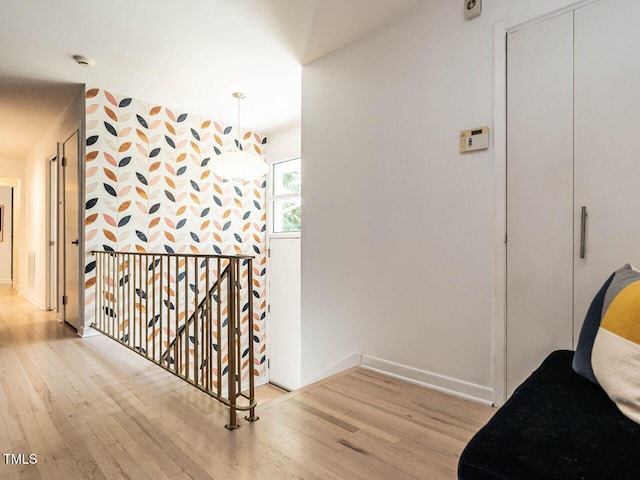 3205 Dell Dr, Raleigh, NC 27609 - hall with wood finished floors and an upstairs landing